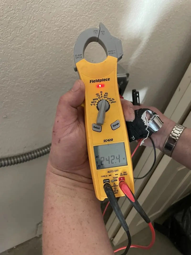 Voltage testing with clamp meter during Recessed Lighting Installation in Ottawa Hills